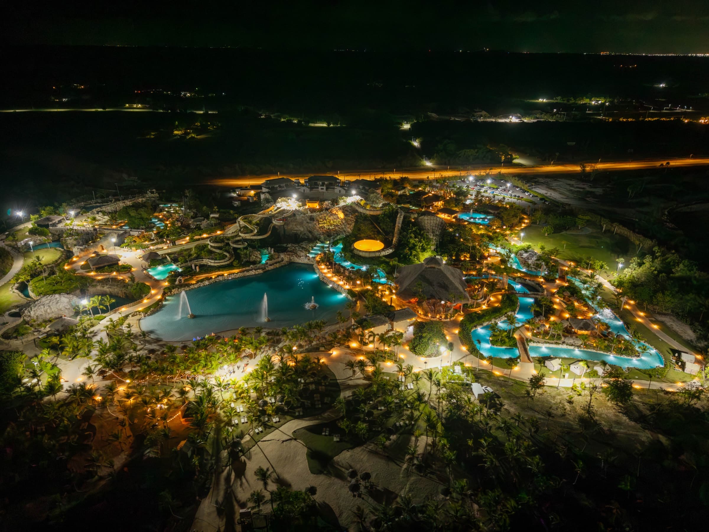 El Dorado Park at night, seen from above, with its pools and paths lit up